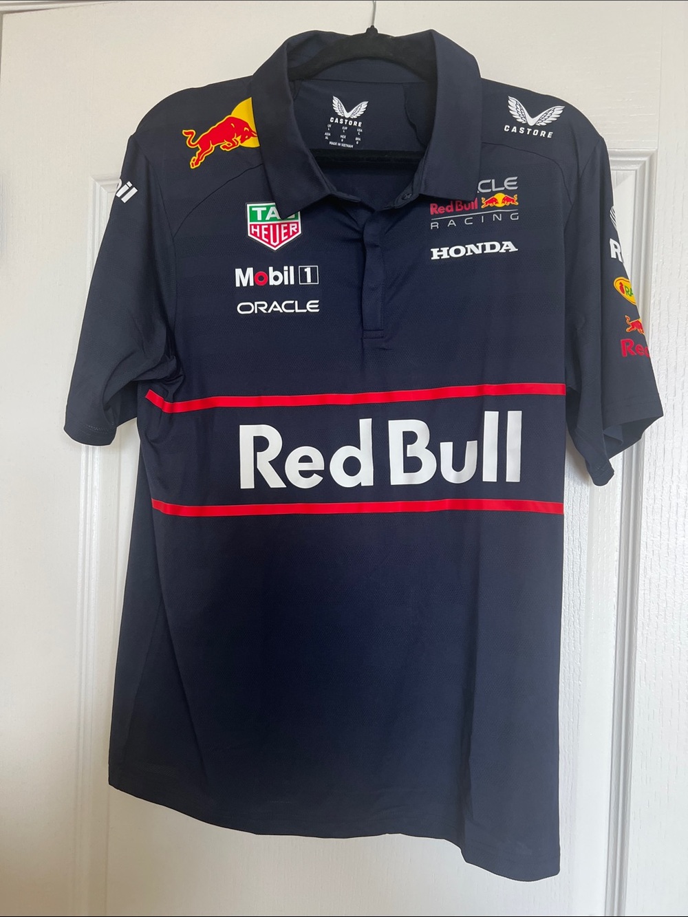 Castore Red Bull Racing Navy Polo with Red Trim